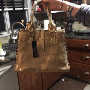 Gold handbag with a mix of gator and snakeskin.